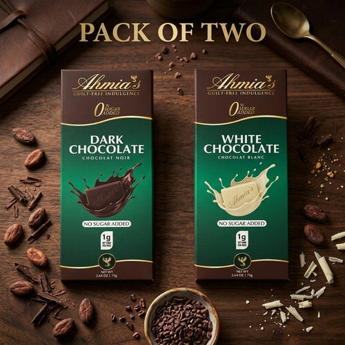 Two packs of Ahmia's no sugar added dark and white chocolate on a wooden surface with cocoa beans and a spoon.